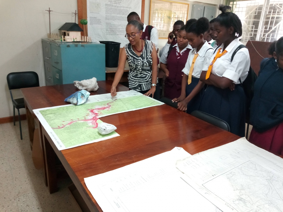 Dr. Edwards with Students showing them a map