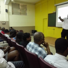 Prof. Taylor speaking to staff members of the Faculty of Science and Technology