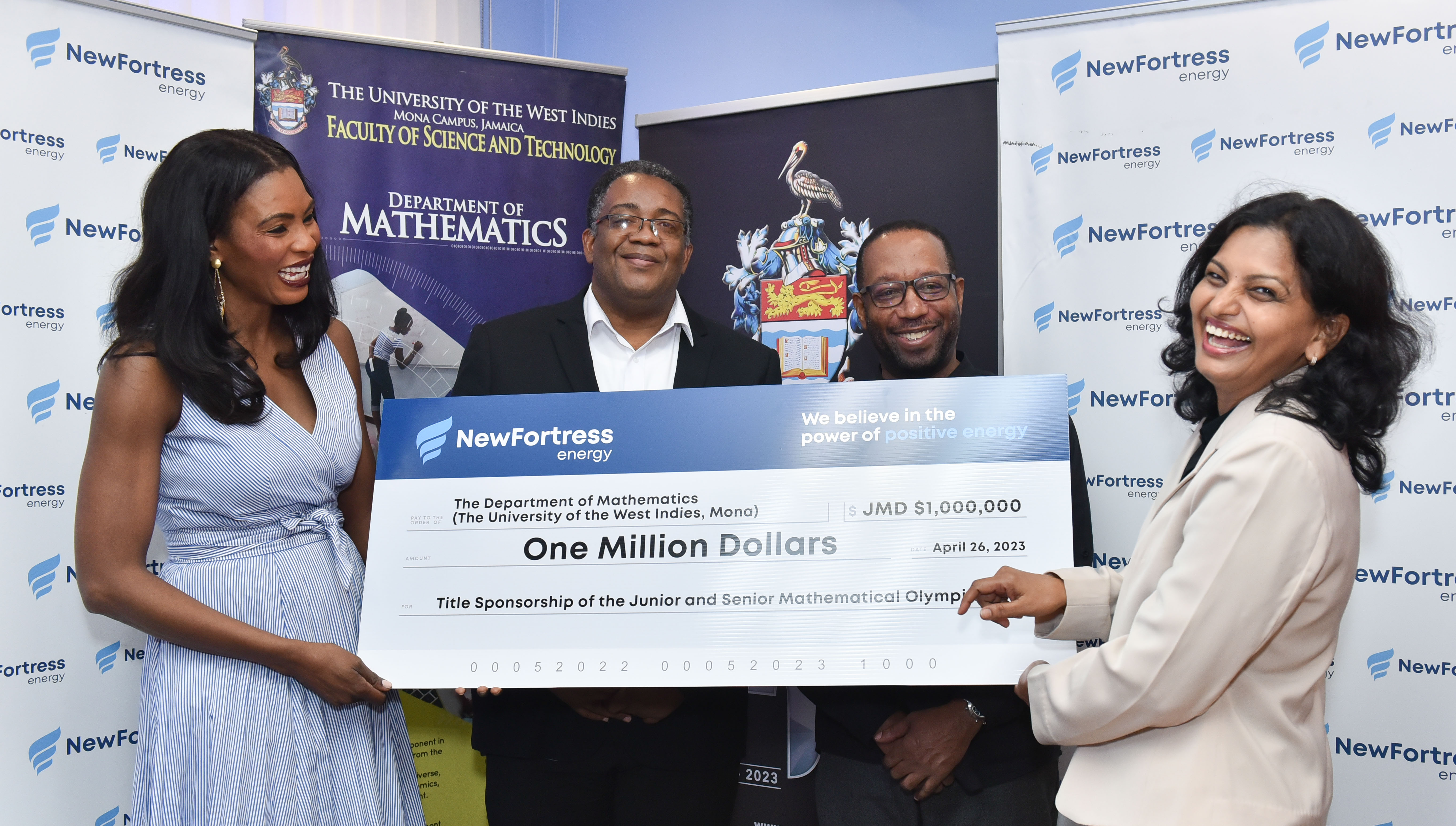 Dr. Nagarani Ponakala (right), Head of the Department of Mathematics happily accepts $1 million (JMD) From Mrs. Verona Carter (left) Vice President of New Fortress Energy. Dean of the Faculty, Professor Michael Taylor (centre left) and the Deputy Principal of the Mona Campus Professor Ian Boxill (centre right) stand in support.