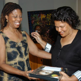Mrs Beverly Anderson-Manley, presents gift to Ms Elinor Sisulu, Zimbabwean/South African Writer, Activist, Gender Specialist, at CGDS Mona Unit Public Lecture, April 23 2007, UWI Mona.