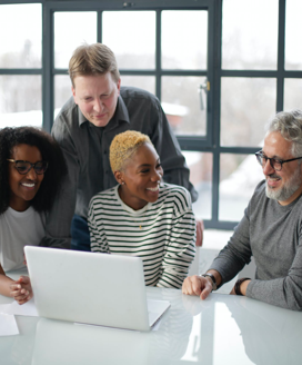 group of people collaborating and laughing