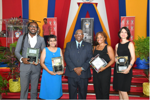 Professor Dale Webber, outgoing Pro-Vice Chancellor and Principal of The University of the West Indies surrounded by some of the Faculty of Law researchers recently honoured at the 25th instalment of the Principal’s Research Awards Ceremony