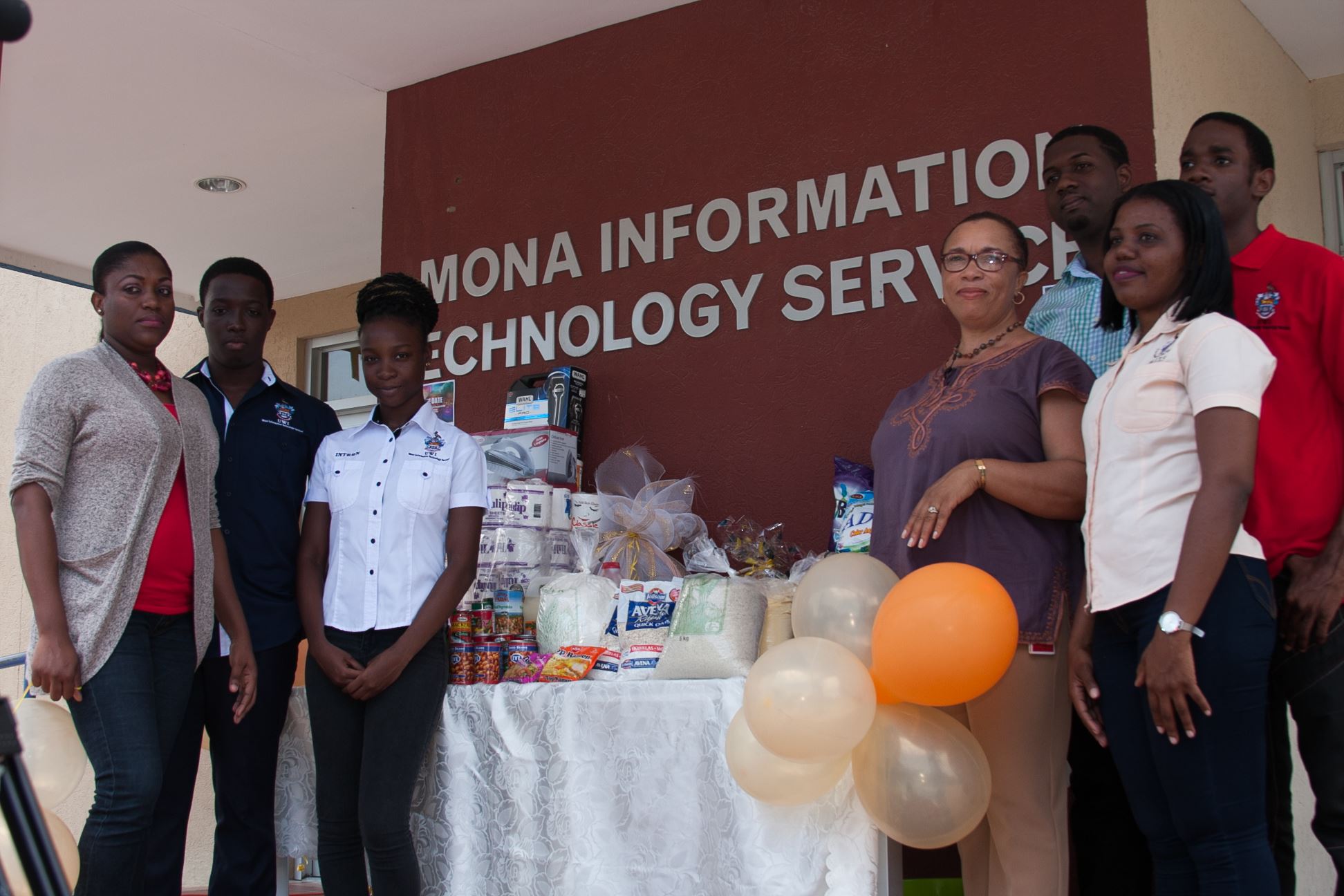 MITS Staff with items to be given to Walkers Place of Safety