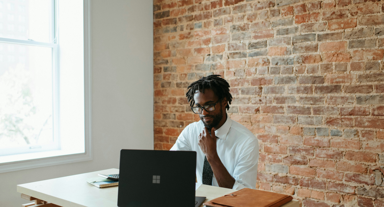 Young black man at a computer in an office