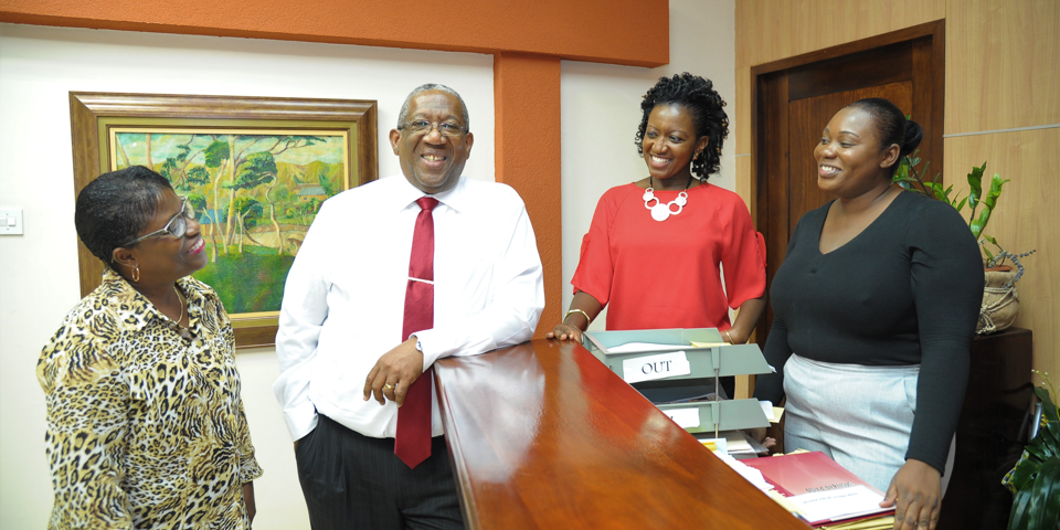 Principal with staff at the Front desk