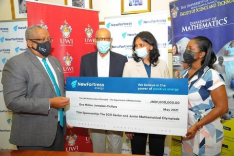 Prof. Dale Webber receives cheque valued at J$1 million from Jacqueline Burrell-Clarke
